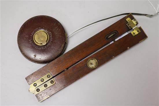 A Dr Bates mahogany and brass clinometer and Chesterman tape measure